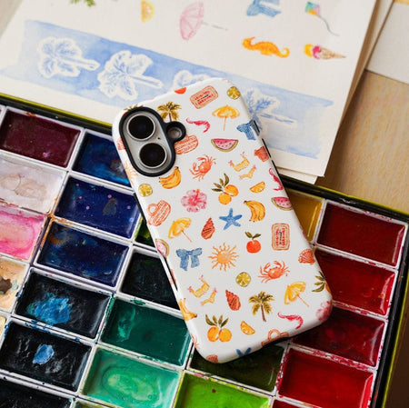 best protective case for the iPhone 17 with fun beach-themed illustrations sitting on the paints used to design it