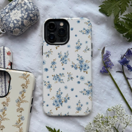 best iPhone 16 Pro case for camera protection with pretty blue flowers printed on it