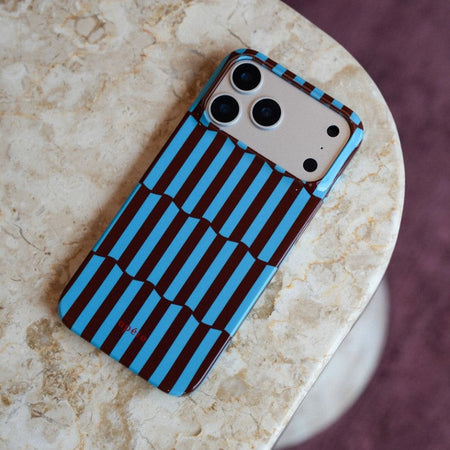 iPhone resting on a stone table with the best protective case for iPhone 17 Pro Max