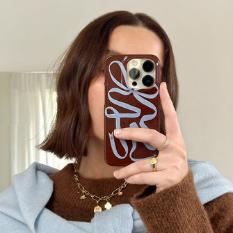 Mocha Ribbon Printed Phone Cases iPhone 16 / Armoured by Jasmine Dowling - The Dairy